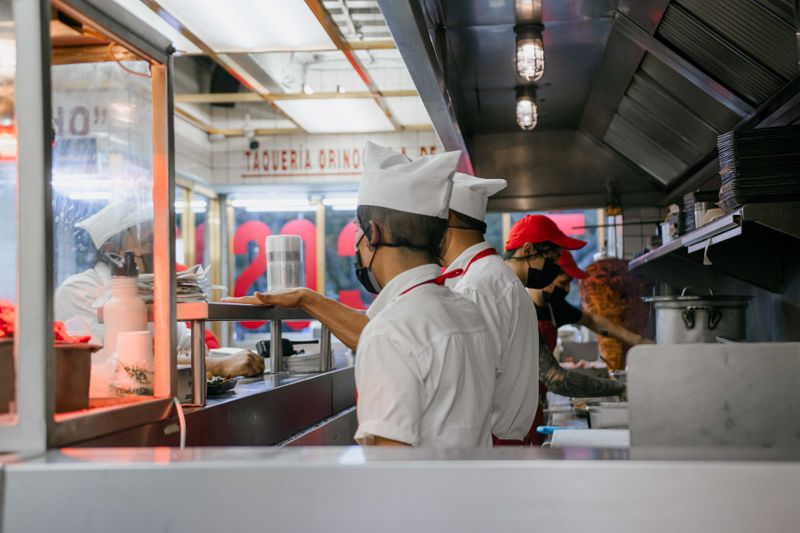 Wing Snob team member smiling at work